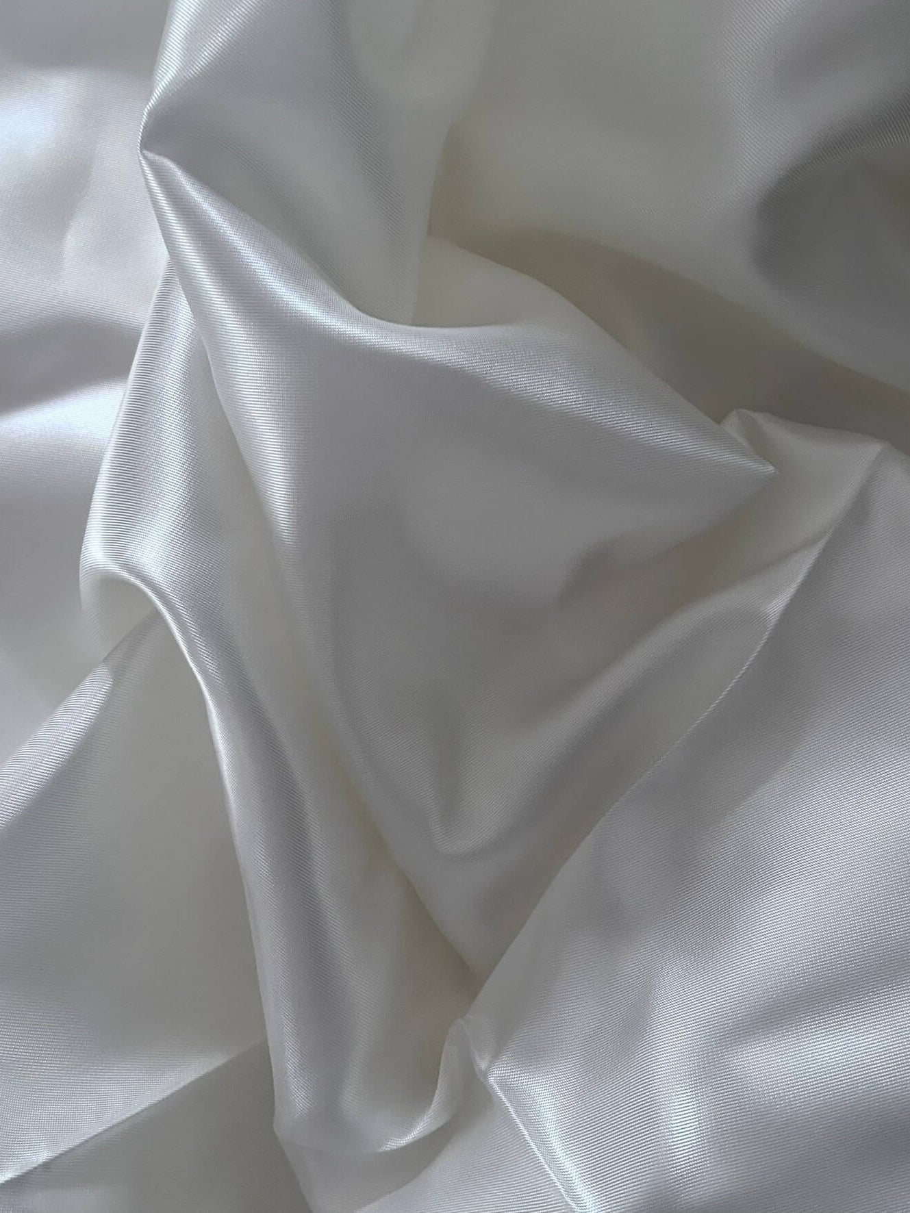 Tessuto lucido e colore panna per creare fodere per borse all'uncinetto