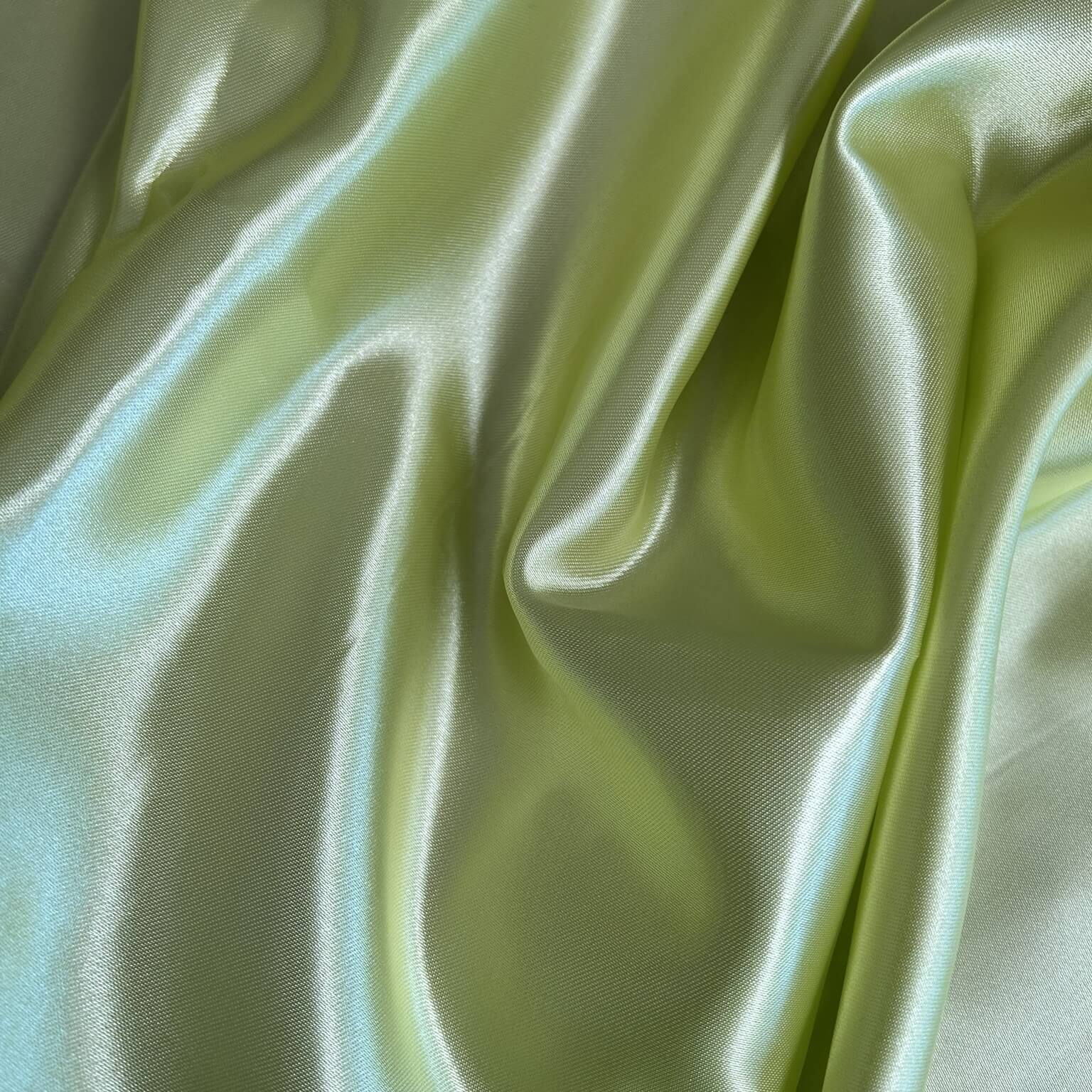 Tessuto lucido e colore verde mela per creare fodere per borse all'uncinetto