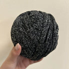 Fettuccia nero con filo argento lurex a forma di tubolare per realizzare borse all'uncinetto